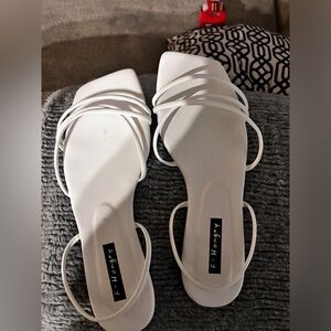 White flat sandals